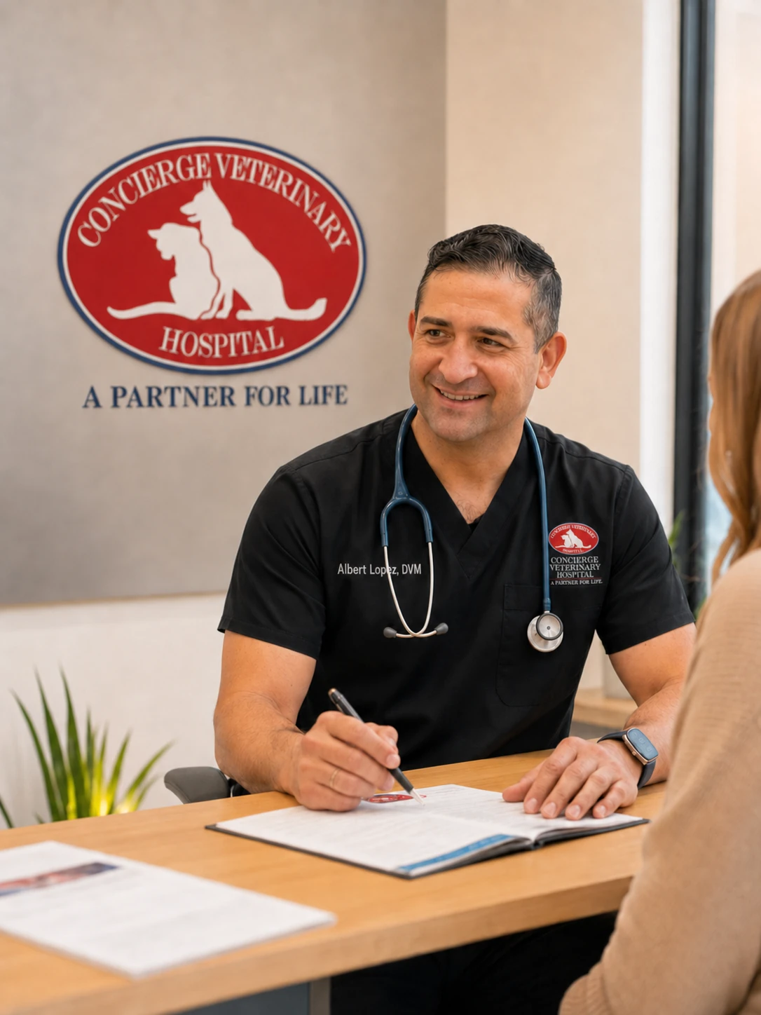 Dr. Albert Lopez, DVM, consulting with a client
