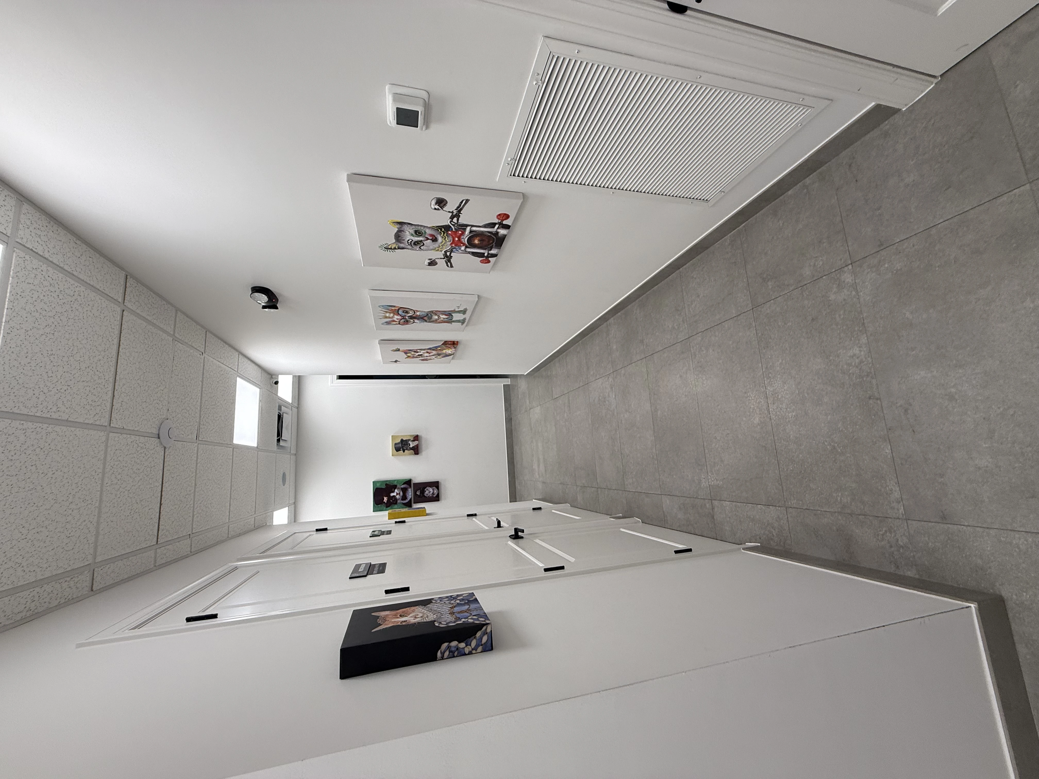 Hallway with pet artwork